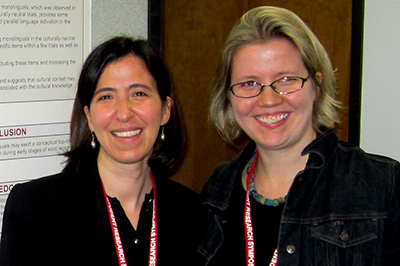 Sebnem Uzuner and Dr. Henrike Blumenfeld standing in front of SRS poster.