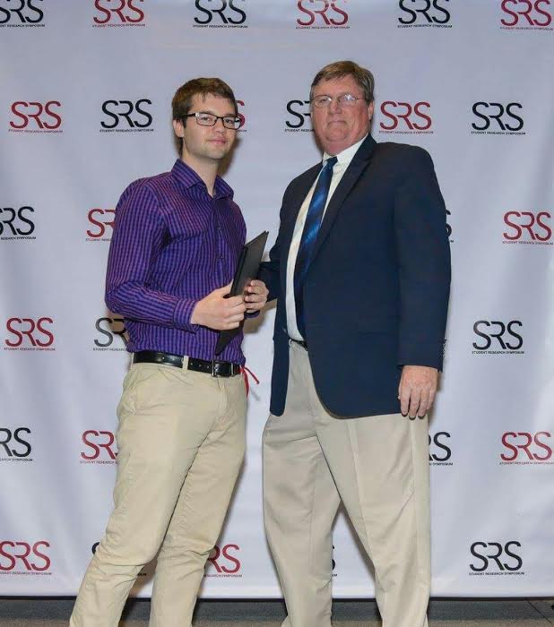 Brad Taylor receiving award